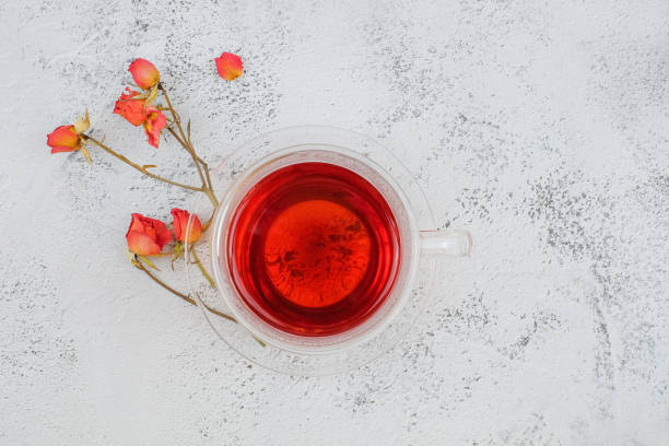 istock glass cup of tea and roses top view 1250288397