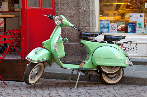 Saint-Malo, France - June 02 2020: An old Vespa PX150 parked in the street.