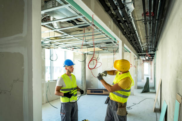 istock Electrician making wiring at new house 1250290380