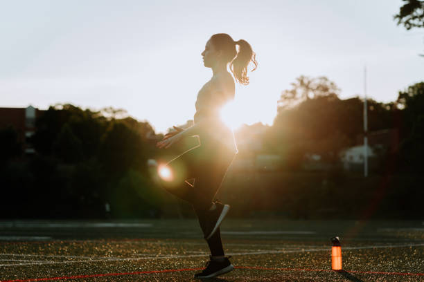 istock Woman Exercising in School Field 1250290587