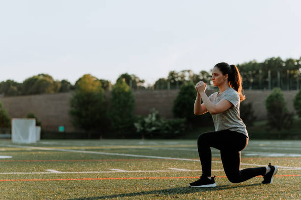 istock Woman Exercising in School Field 1250290653
