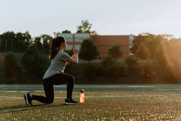 istock Woman Exercising in School Field 1250290760