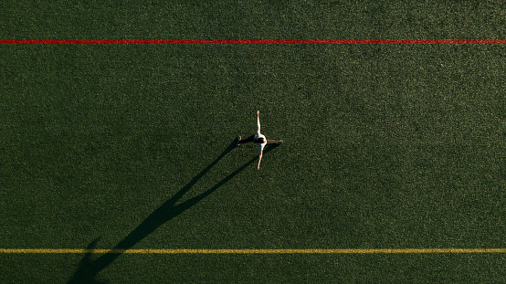 Aerial View Woman Exercising in School Field