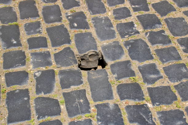 Missing cobblestone in a cobblestone street