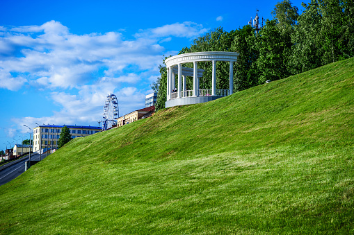 Rotunda on the embankment on a warm evening before sunset. Izhevsk, Russia