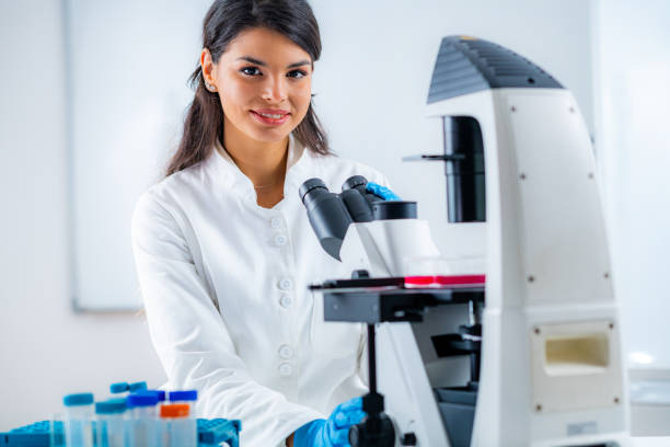 istock Biology Student Researcher Looking Through the Microscope 1250293307