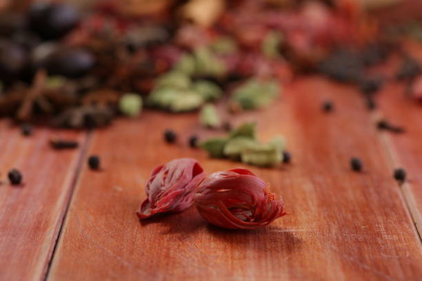 Mace or Javithri flower Mace or Javithri flower_dry spice arranged in a sack_javithri flower or jathipathri arranged on a wooden surface ,selective focus mace spice stock pictures, royalty-free photos & images