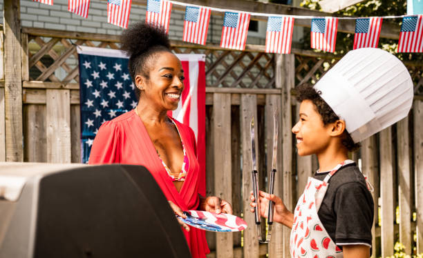 istock Young Chef anf his mother at 4th July BBQ 1250293682