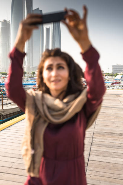 istock woman take a selfie in abu dhabi 1250296219