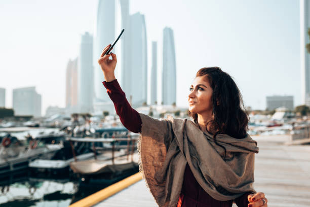 istock woman take a selfie in abu dhabi 1250296349