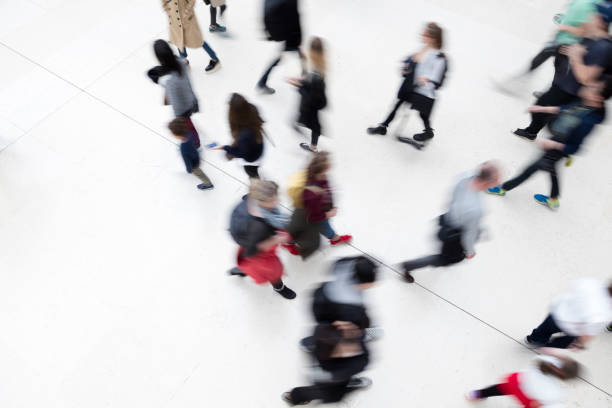 istock Group of People Walking, Elevated View, Motion Blur Effect 1250297231