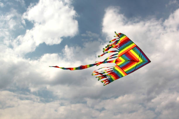 istock view of multicolored kite flying in the sky with clouds 1250298398