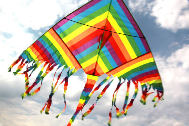 istock view of multicolored kite flying in the sky with clouds 1250298563