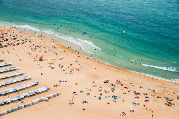 istock Panoramic view of ocean sand beach drone view. 1250299831