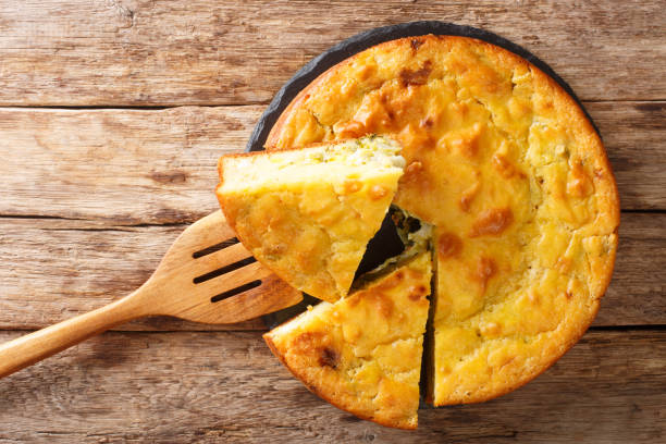 istock Russian cuisine pie stuffed with cabbage, herbs and boiled eggs close-up on a slate board. Horizontal top view 1250300039