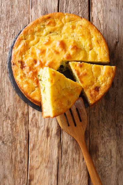 istock Traditional pie with cabbage, herbs and boiled eggs close-up on a slate board. Vertical top view 1250300758