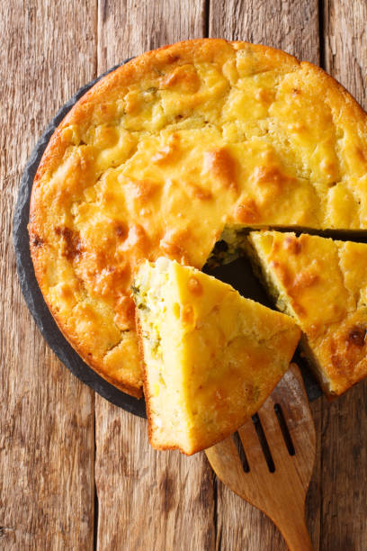 istock Homemade sliced cabbage pie with herbs and boiled eggs close-up. Vertical top view 1250300870