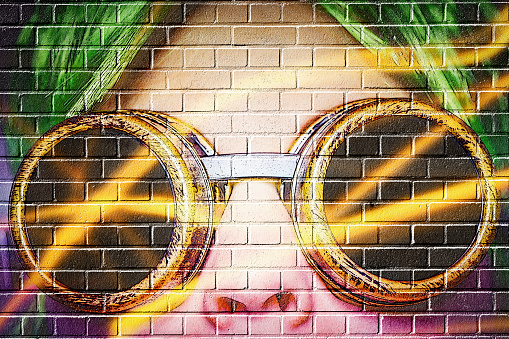 womans face on a brick wall - the graffitilook is not a real graffiti it is a manipulated photopraphy