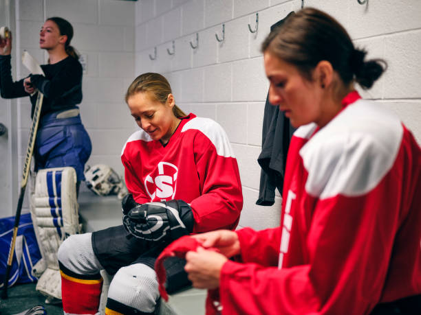istock Women's Hockey Team in a Locker Room 1250303313