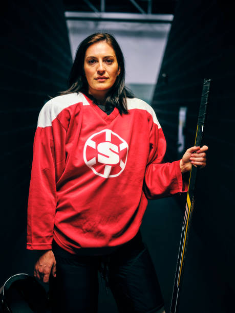 istock Woman Hockey Player 1250303914
