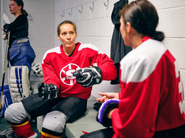istock Women's Hockey Team in a Locker Room 1250303949
