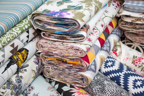 istock Fabricate silk and cloth on the shop shelf, multicolored and many pattern, rolled silk in the market in Tbilisi, Georgia. 1250304028
