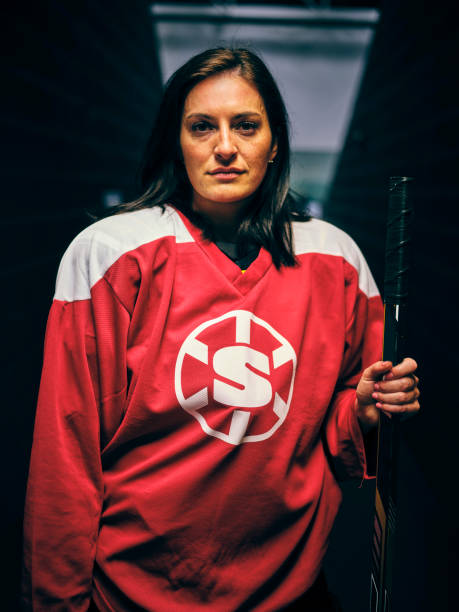 istock Woman Hockey Player 1250304042