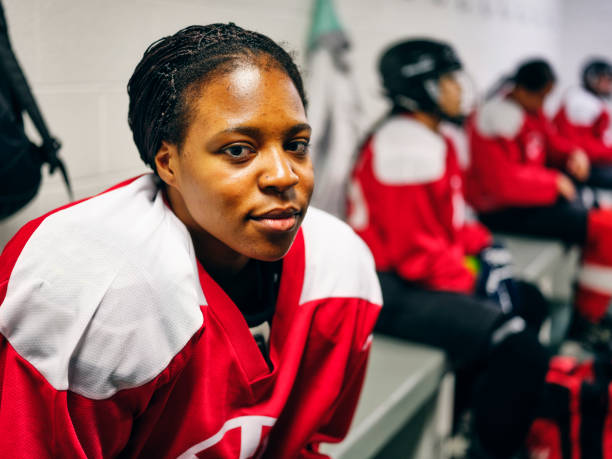 istock Women's Hockey Team in a Locker Room 1250304111
