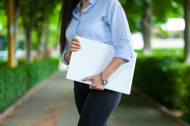 istock woman hand computer in street 1250304782