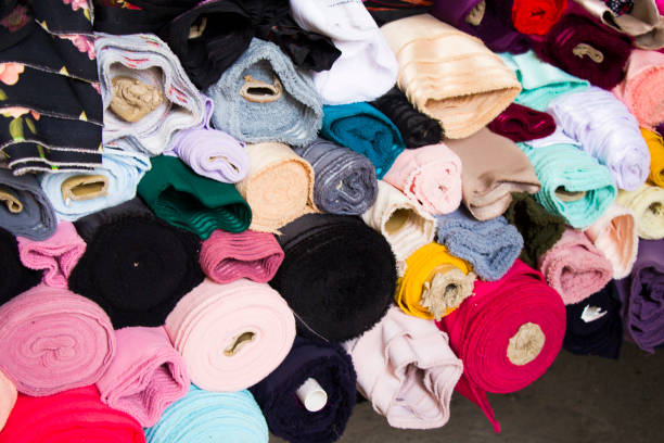 istock Fabricate silk and cloth on the shop shelf, multicolored and many pattern, rolled silk in the market in Tbilisi, Georgia. 1250304881