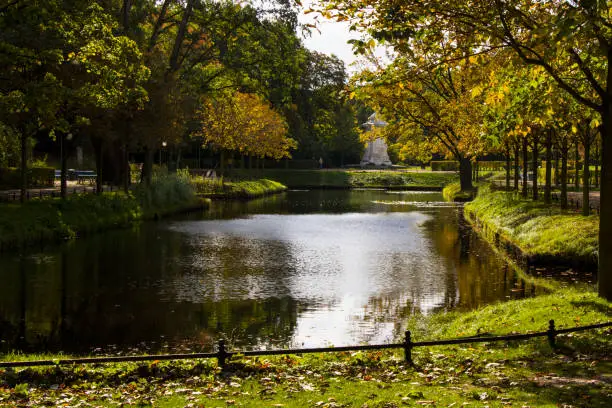 Park in Berlin, water, trees and autumn time, urban recreation. Germany park.