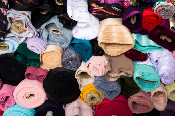 istock Fabricate silk and cloth on the shop shelf, multicolored and many pattern, rolled silk in the market in Tbilisi, Georgia. 1250305283