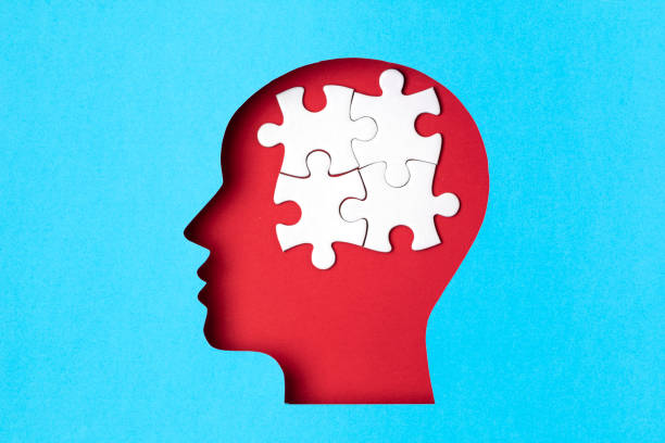 istock Papercut head with jigsaw puzzle pieces inside. Mental health problems, psychology, memory, logic, thinking process, solution, mental illness 1250310785