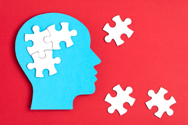 istock Papercut head with jigsaw puzzle pieces inside. Mental health problems, psychology, memory, logic, thinking process, solution, mental illness 1250310793