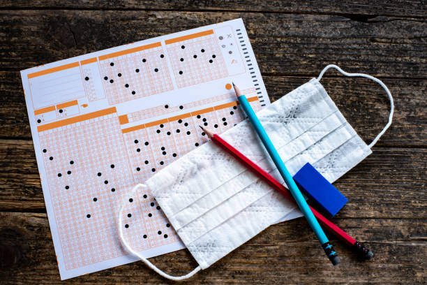 multiple choice exam with mask because of coronavirus. exams like toefl , lgs, tuss, ösym, ygs, yks - medical exam fotos imagens e fotografias de stock