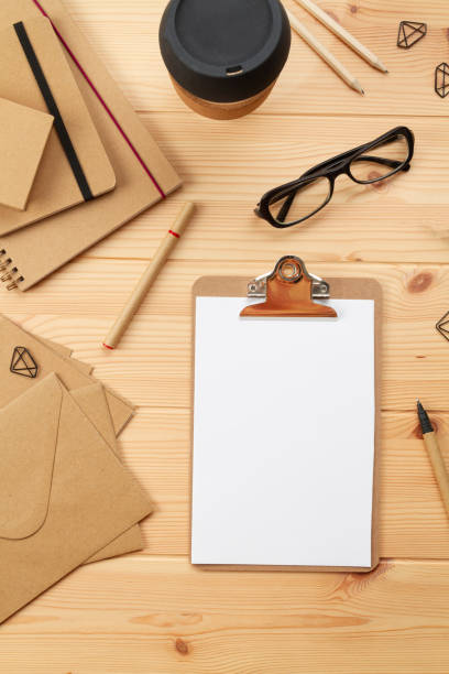 istock Top view over working place with laptop and office supplies 1250310935