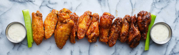 istock line of buffalo wings with different flavors 1250310961