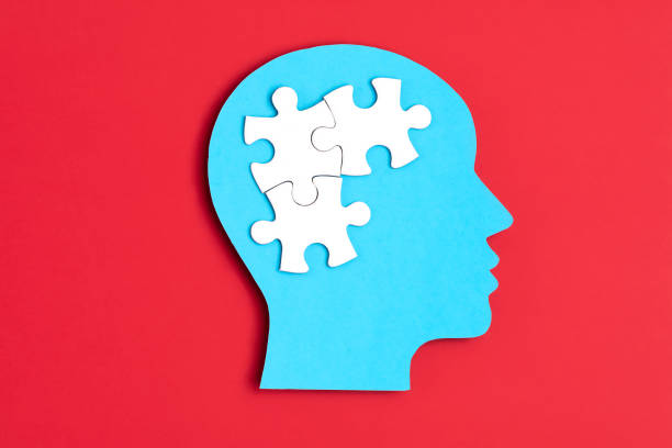 istock Papercut head with jigsaw puzzle pieces inside. Mental health problems, psychology, memory, logic, thinking process, solution, mental illness 1250311000