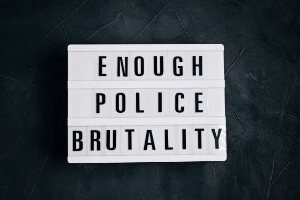 istock Enough Police brutality text on light box on dark background 1250311030