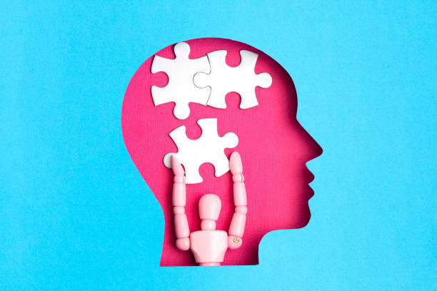 istock Papercut head with jigsaw puzzle pieces inside. Mental health problems, psychology, memory, logic, thinking process, solution, mental illness 1250311046