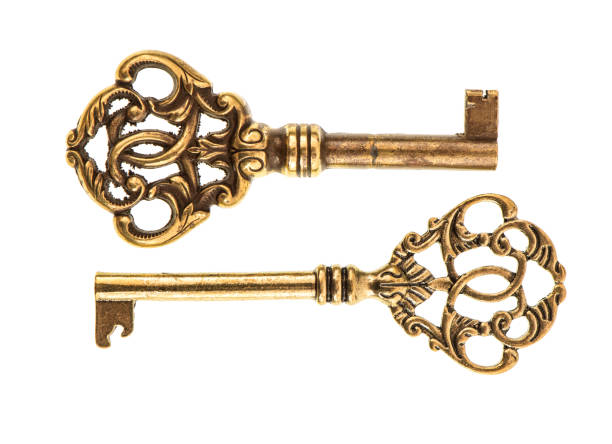 istock Golden antique keys isolated white background 1250312756