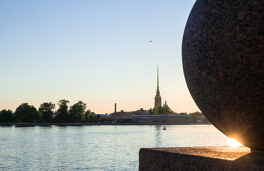 St. Petersburg, Russia. June 13, 2020. View of the Petropavlovsk fortress through the waters of the Neva River at dawn. A beautiful morning in June. Horizontal orientation, selective focus.