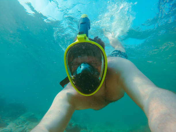 istock man with snorkeling mask underwater summer sea vacation 1250314943