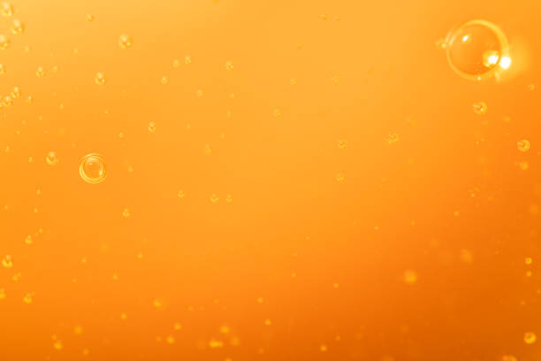 istock Macro Photo Of Orange Liquid Bubbles In Abstract Form 1250315081