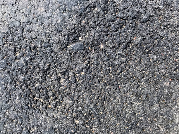 istock Close-up, small gray concrete pebbles with stone background 1250316616