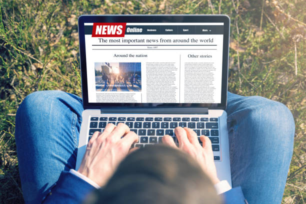 istock Work outside concept. Men reading news on a computer screen. Mockup website. Newspaper and portal on internet 1250319794