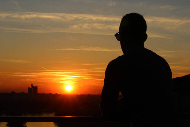 istock Young man enjoy in sunset 1250326459