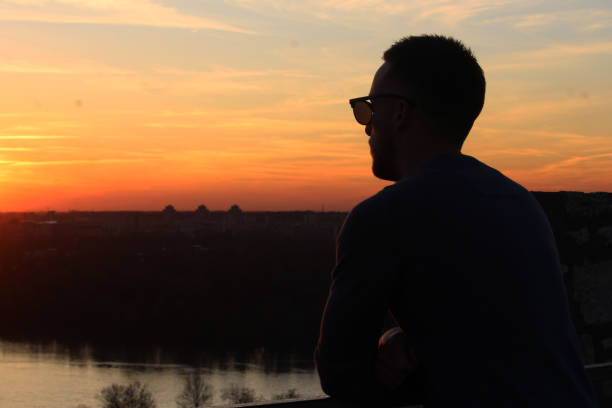 istock Young man enjoy in sunset 1250326491