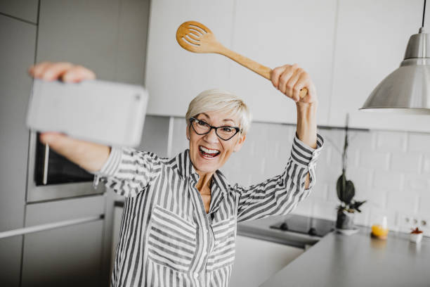 istock Senior woman vlogging 1250326586