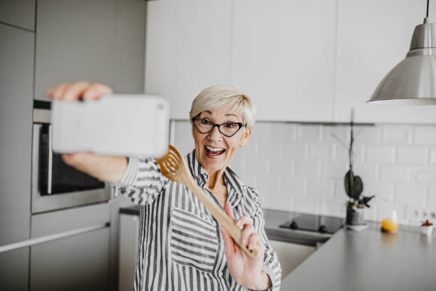 istock Senior woman vlogging 1250326616